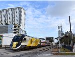 Southbound Brightline Bright Pink Set departing Downtown WPB 